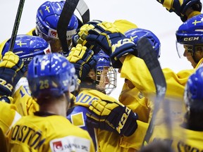 Alexander Nylander of Sweden, centre, and teammates celebrating after Nylander scored during the 2016 IIHF World Junior Ice Hockey Championship match between Sweden and USA in Helsinki, Finland, Monday, Dec. 28, 2015. (Roni Rekomaa/Lehtikuva via AP)