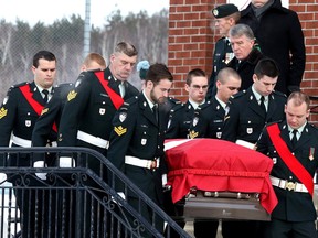 Gino Donato/Sudbury Star
Members of the military carry the casket of Robert Giblin out of Bancroft Community Church following his funeral service on Monday.