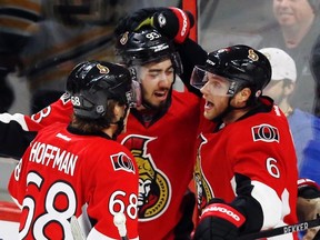 Ottawa Senators' Mika Zibanejad (93) celebrates his goal with teammates Bobby Ryan (6) and Mike Hoffman (68) during second period NHL hockey action against the Boston Bruins in Ottawa on Sunday, December 27, 2015. (THE CANADIAN PRESS/Fred Chartrand)