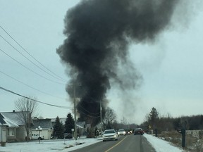 A home in Vars, 30 minutes east of Ottawa, goes up in smoke after a fire broke out in the home's garage. Of the three family members home during the blaze, only the father suffered burns on his face and was taken to hospital with non life-threatening injuries. Photo taken on Monday, December 28, 2015. (Photo courtesy of Lisa Lanthier)