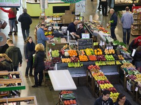 People shop at the Covent Garden Market. While the Canadian economy struggled to grow this year, Ontario was the exception with retail sales up 3.9 per cent year-over-year. (DEREK RUTTAN, The London Free Press)