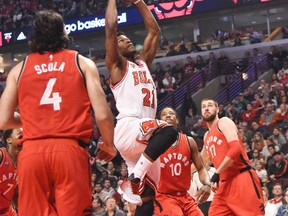 Bulls guard Jimmy Butler (21) shoots the ball against the Raptors during first half NBA action in Chicago on Monday, Dec. 28, 2015. (David Banks/USA TODAY Sports)