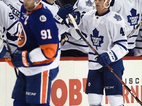 Maple Leafs forward Michael Grabner celebrates his goal on Dec. 27, 2015, with his new teammates as former teammate John Tavares skates away. Grabner has six points in his past five games. (KATHY KMONICEK/AP)