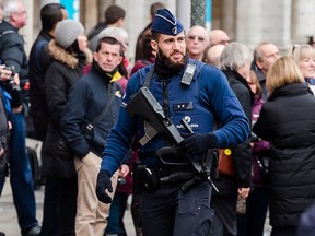 An armed police man patrols at the Grand Place in Brussels on Tuesday, Dec. 29, 2015. (AP Photo/Geert Vanden Wijngaert)