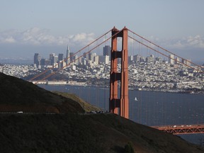 This Oct. 28, 2015, photo shows the Golden Gate Bridge and San Francisco skyline from the Marin Headlands above Sausalito, Calif. The Golden Gate Bridge is only 2.7 kilometers long, but its appeal spans the world. You can drive, bike or walk across to the Marin Headlands.  (AP Photo/Eric Risberg)