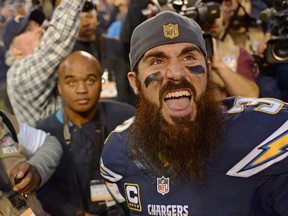 San Diego Chargers free safety Eric Weddle (32) reacts to fans after the Chargers beat the Miami Dolphins 30-14 at Qualcomm Stadium. Jake Roth-USA TODAY Sports
