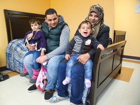 Syrian refugees Mohammad Al Amour and Shoroq Abo Arah with their children Aya and Rasheed at the Cross Cultural Learning Centre where they are beginning a new chapter of their lives in London, Ont. on Tuesday December 29, 2015. The family arrived in Canada on Sunday. (DEREK RUTTAN, The London Free Press)
