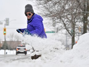 Like many area residents, Stephanie Poirier of Barrie isn't a fan of shoveling snow but admitted that it was about time that it showed up. 
Mark Wanzel/Barrie Examiner