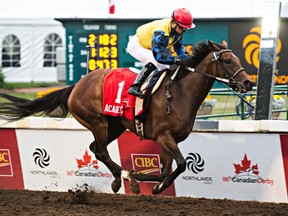 Academic, ridden by jockey Justin Stein, crosses the finish line first during the 86th running of the Canadian Derby at Northlands Park in Edmonton, Alta. on Saturday, Aug. 15, 2015. Codie McLachlan/Edmonton Sun