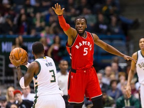 Toronto Raptors forward DeMarre Carroll defends Milwaukee Bucks guard O.J. Mayo during the second quarter at BMO Harris Bradley Center in Milwaukee on Dec. 26, 2015. (Jeff Hanisch/USA TODAY Sports)