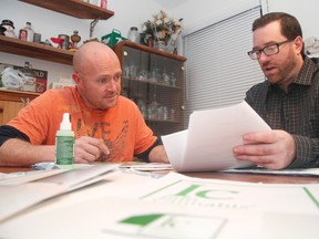 Frank Medewar of InfoCannabis, right, explains to a potential client about what medicinal marijuana is all about. (Postmedia Network)