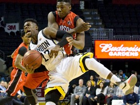 London Lightning?s Tyshawn Patterson yells as he collides with Shaquille Keith of the Windsor Express at centre court during a National Basketball League of Canada game at Budweiser Gardens on Dec. 29, 2015. (CRAIG GLOVER, The London Free Press)