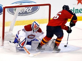 Panthers centre Aleksander Barkov (right) scores past Canadiens goalie Ben Scrivens during third period NHL action in Sunrise, Fla., on Tuesday, Dec. 29, 2015. (Robert Mayer/USA TODAY Sports)