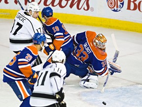 Edmonton's goalie Cam Talbot (33) stops Los Angeles' Milan Lucic (17) from scoring during the first period of the Edmonton Oilers' NHL hockey game against the LA Kings at Rexall Place in Edmonton, Alta., on Tuesday, Dec. 29, 2015. Codie McLachlan/Edmonton Sun/Postmedia Network