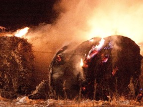 A file photo shows a hay bale fire.