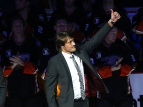Former Anaheim Ducks star Teemu Selanne waves to the crowd during ceremonies retiring Selanne's number by the Ducks before the game with the Winnipeg Jets at Honda Center on January 11, 2015 in Anaheim, California.
