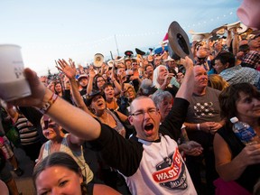 Fans play a radio station ping pong ball give away game during Big Valley Jamboree 2015 in Camrose, Alta. on Thursday July 30, 2015. Ian Kucerak/Edmonton Sun/Postmedia Network