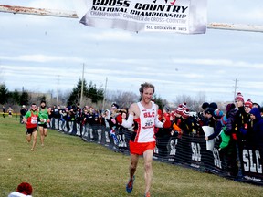 Sydenham’s Rob Asselstine, of St. Lawrence College’s Kingston campus, crosses the finish line first in the men's race at the Canadian Collegiate Athletic Association cross-country championships in Brockville on Nov. 14.
(Ronald Zajac/Postmedia Network)
