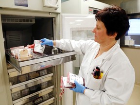 Luke Hendry/The Intelligencer
Senior technologist Hertha Hughes places a unit of blood into storage at the Quinte Health Care laboratory at Belleville General Hospital. The corporation's four hospitals use about 300 units a month. Canadian Blood Services is short about five per cent of its local collection target.