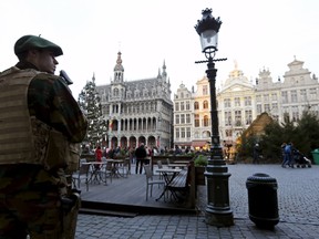 A Belgian soldier patrols on Brussels' Grand Place, December 30, 2015, after two people were arrested in Belgium on Sunday and Monday, both suspected of plotting an attack in Brussels on New Year's Eve, federal prosecutors said.    REUTERS/Francois Lenoir