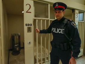 Const. Andy Pattenden shuts the cell door. York Regional Police took media through the process of being arrested for impaired driving. Their message: You do not want to stay at L'Hotel York Regional Police. (Dave Thomas/Toronto Sun/Postmedia Network)