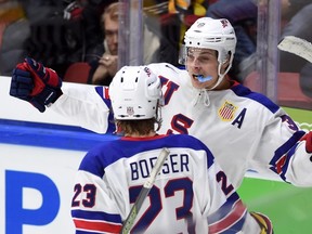 United States' Auston Matthews celebrates a goal with teammate Brock Boeser during a game against Canada at the World Junior Hockey Championship in Helsinki on Dec. 26, 2015. (THE CANADIAN PRESS/Sean Kilpatrick)