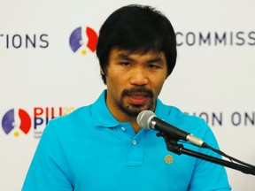 Manny Pacquiao is returning to the ring in the new year to face familiar foe Timothy Bradley. (Bullit Marquez/AP Photo)