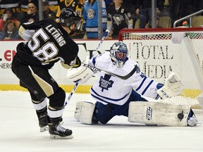 Maple Leafs goalie Jonathan Bernier makes the game-winning save against Penguins defenceman Kris Letang in a shootout during NHL action in Pittsburgh on Wednesday, Dec. 30, 2015. (Don Wright/USA TODAY Sports)