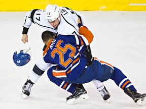 Edmonton's Darnell Nurse (25) fights Los Angeles' Milan Lucic (17) during the first period of the Edmonton Oilers' NHL hockey game against the LA Kings at Rexall Place in Edmonton, Alta., on Tuesday, Dec. 29, 2015. Codie McLachlan/Edmonton Sun/Postmedia Network