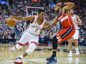 Raptors point guard Kyle Lowry drives the ball against Wizards' Garrett Temple during first half NBA action in Toronto on Wednesday, Dec. 30, 2015. (Ernest Doroszuk/Toronto Sun)