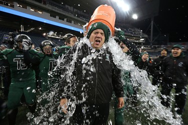 2015 YEAR IN REVIEW � Vincent Massey Trojans head coach Kelsey McKay is doused with ice water after beating the St. Paul's Crusaders to win the WHSFL AAA championship game in Winnipeg on Fri., Nov. 13, 2015. Kevin King/Winnipeg Sun/Postmedia Network