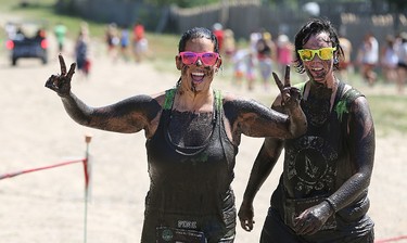 2015 YEAR IN REVIEW � Participants tackle the Mud Hero Winnipeg course at Hill Top Resort near Grand Beach on Sat., July 25, 2015. The six-kilometre course had more than 15 obstacles and, of course, plenty of mud. Kevin King/Winnipeg Sun/Postmedia Network