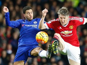 Manchester United’s Bastian Schweinsteiger, right, is challenged by Chelsea’s Eden Hazard during English Premier League play at Old Trafford Stadium in Manchester Monday, Dec. 28, 2015. (AP Photo/Jon Super)