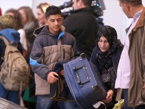 Syrian refugees arrive in Winnipeg.