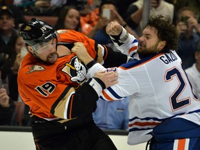 Nov 11, 2015; Anaheim, CA, USA; Anaheim Ducks left wing Patrick Maroon (19) and Edmonton Oilers left wing Luke Gazdic (20) fight in the second period at Honda Center. (Kirby Lee-USA TODAY Sports)