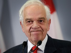 The Honourable John McCallum updates the media on refugees coming to Canada at Pearson Airport in Toronto, Ont. on Thursday December 31, 2015. Craig Robertson/Toronto Sun/Postmedia Network