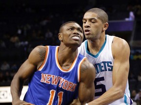 In this Oct. 17, 2015, file photo, New York Knicks' Cleanthony Early (11) is fouled by Charlotte Hornets' Nicolas Batum (5) in the first half of an NBA preseason basketball game in Charlotte, N.C. Law enforcement officials say Early was shot in the leg during a robbery early Wednesday, Dec. 30, outside a strip club in the borough of Queens in New York. (AP Photo/Chuck Burton)