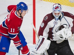 Montreal Canadiens’ Brendan Gallagher (11) moves in on Colorado Avalanche’s goaltender Reto Berra during NHL action in Montreal, Saturday, November 14, 2015. (THE CANADIAN PRESS/Graham Hughes)