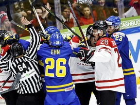 Players of Canada and Sweden in action during the 2016 IIHF World Junior U20 Ice Hockey Championships tournament match between Canada and Sweden in Helsinki, Finland December 31, 2015. REUTERS/Roni Rekomaa/Lehtikuva