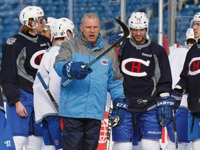 Montreal Canadiens head coach Michel Therrien gives instructions during practice on the outdoor rink at Gillette Stadium in Foxborough, Mass., Thursday, Dec. 31, 2015. (AP Photo/Michael Dwyer)