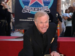 Actor Wayne Rogers attends the unveiling of his star on the Hollywood Walk of Fame December 13, 2005. With an acting career spanning for almost 50 years, Rogers is best known for playing the role of "Trapper John McIntyre" in the long-running U.S. television series, M*A*S*H.