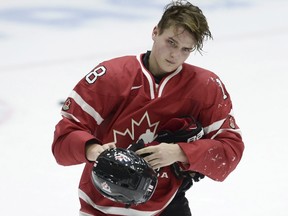 Canada's Jake Virtanen looks on during a world junior championship match against Switzerland in Helsinki on Dec. 29, 2015. (Heikki Saukkomaa/Lehtikuva via AP)