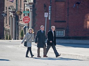 Dennis Oland, his wife Lisa and Oland family lawyer Bill Teed head to the Law Courts after four days of jury deliberations where he was found guilty of second degree murder in the death of his father, Richard Oland, in Saint John, N.B. on Saturday, Dec. 19, 2015. Oland was taken into custody after the verdict was read. Richard Oland was found dead in his Saint John office on July 7, 2011. THE CANADIAN PRESS/Andrew Vaughan