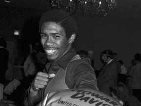 In this Dec. 17, 1976, file photo, Howard Davis, the Olympic gold medal winner in the lightweight boxing division, poses for photographers at a press conference in New York, where he announced that he was turning professional. (AP Photo/File)