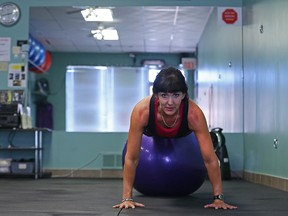 Co-owner Sandi Knox exercises at Body Balance Fitness on Henderson Highway on Thu., July 30, 2015. On Aug. 3 in Toronto, Knox’s inspirational story led her to be selected as fitness professional of the year at the World Fitness Expo.
(Kevin King/Winnipeg Sun/Postmedia Network)