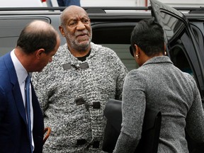 Actor and comedian Bill Cosby is helped as he arrives for a court appearance, Wednesday, Dec. 30, 2015, in Elkins Park, Pa. Cosby was arrested and charged with drugging and sexually assaulting a woman at his home in January 2004. (AP Photo/Mel Evans)