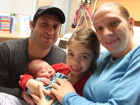 Roberto and Abby Spadafora pose in Sarnia hospital with their children Lily, 6, and Lorenzo, born Friday. The eight-pound newborn was Sarnia's first baby of 2016, born at 12:54 a.m. (Tyler Kula/Sarnia Observer/Postmedia Network)
