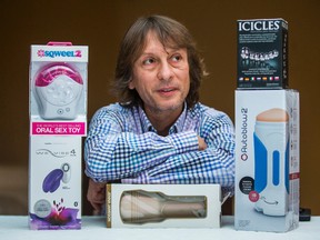 Roberto Piazza, founder of Hotme.ca, poses for a photo with an assortment of sex toys. Piazza says his Vaughan company will deliver any sex toy in about an hour. They'll even pick you up a bag of McDonald's on the way. (Ernest Doroszuk/Toronto Sun/Postmedia Network)