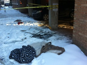 Blankets were left on the ground at the scene of New Years Day fire in the 100 block of Colony Street, which caused a couple and their baby to leap out of a second-storey window to escape the flames. They were in hospital at last report in unknown condition. (GLEN DAWKINS, Winnipeg Sun/Postmedia Network)