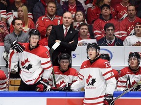 Canada's head coach Dave Lowry looks from the bench as his team battles Sweden at the world junior championship in Helsinki on Dec. 31, 2015. (THE CANADIAN PRESS/Sean Kilpatrick)